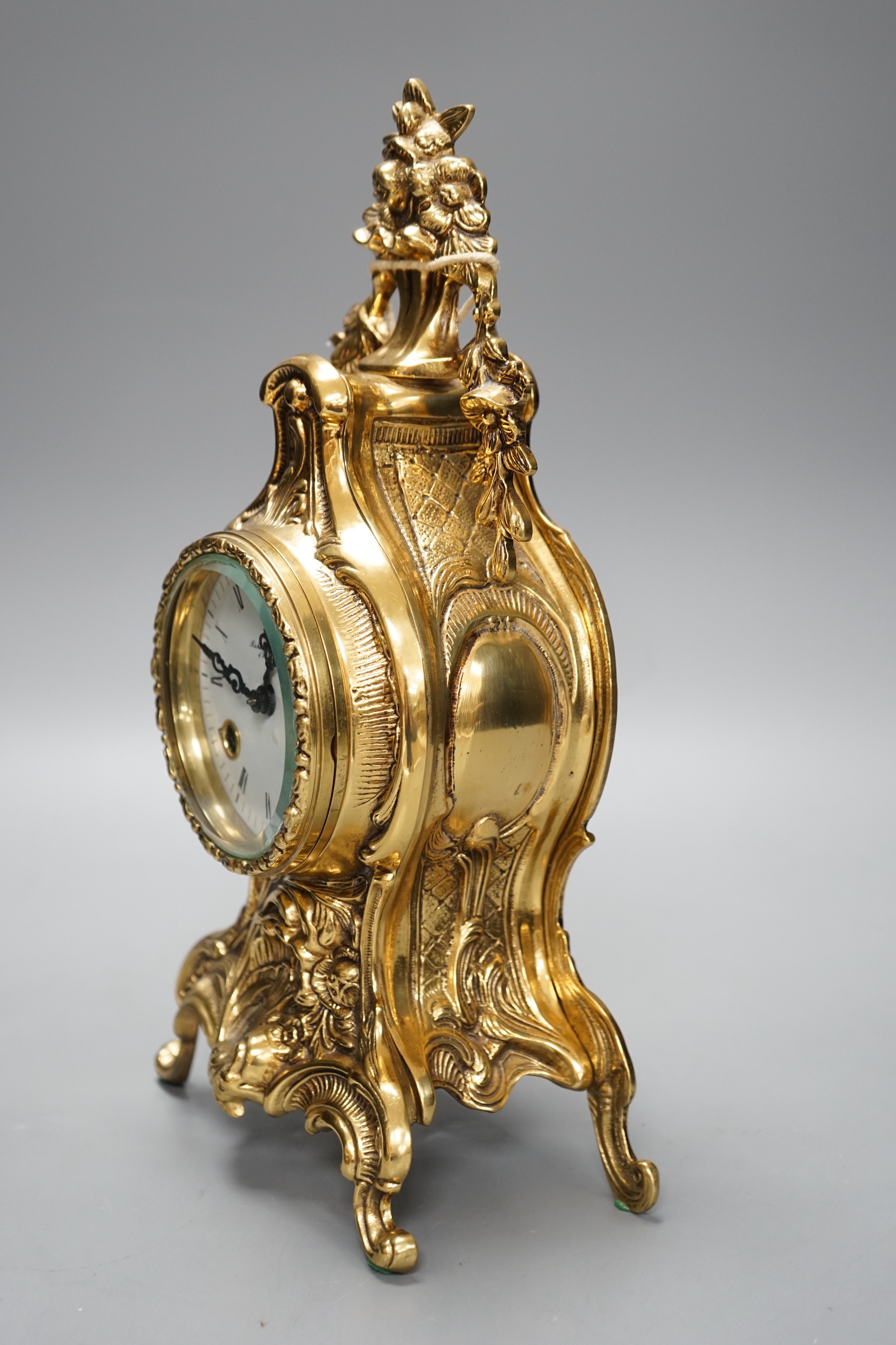 A Franz Hermle cast brass mantel clock, 123-070 movement, floating balance, eight day bim bam strike, 33cm